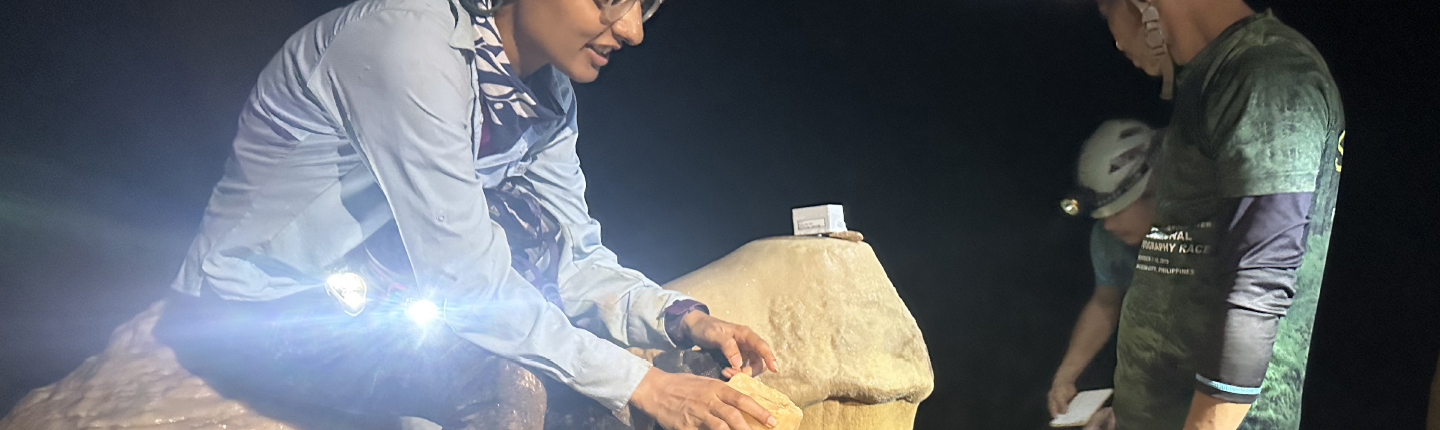 Assistant Professor Natasha Sekhon studies broken stalagmites to decide whether they should be brought back to the U.S. for further research. 