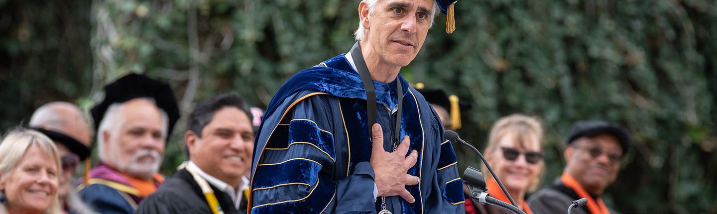 Occidental College President Tom Stritikus addresses the audience from the podium on his Inauguration Day