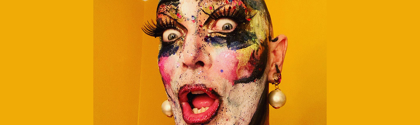 Drag performer Taylor Mac with huge false eyelashes and dramatic, glittery makeup