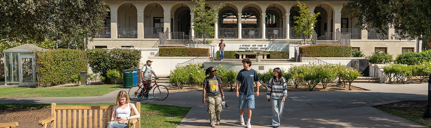Occidental College students walk outside of the Johnson Student Center