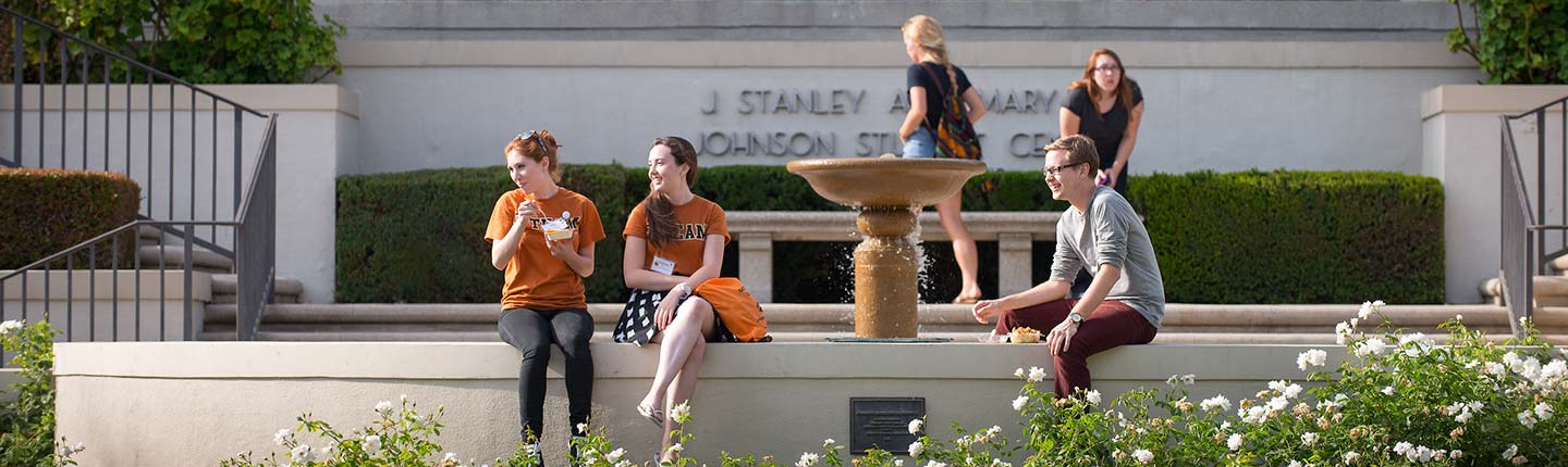 Students relax in front of Johnson Student Center