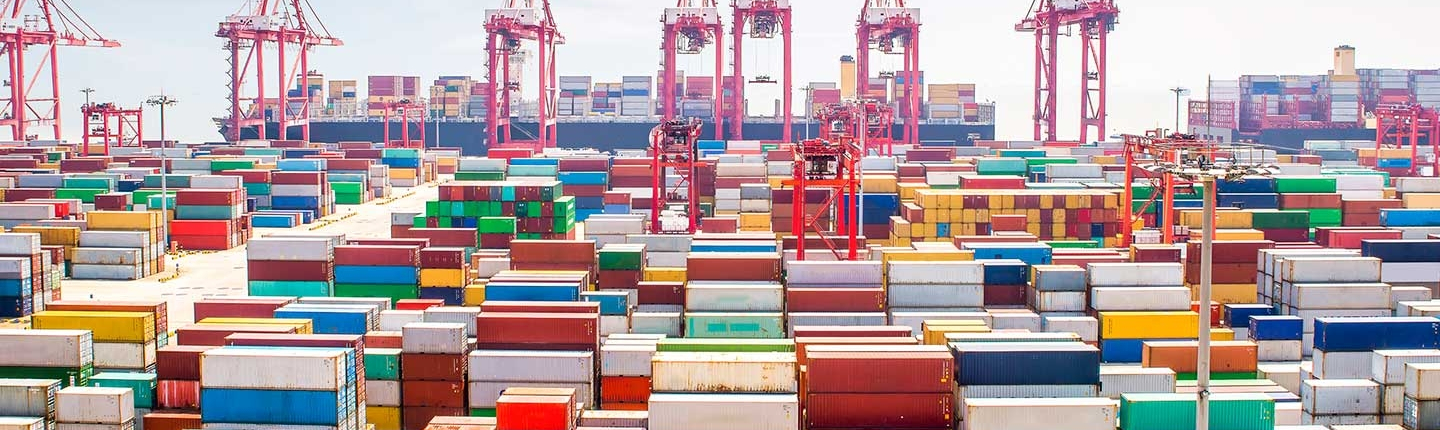  A busy maritime container port with multicolored cargo containers