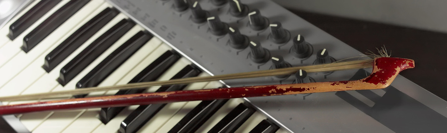 an electronic keyboard controller with a violin bow resting on its keys