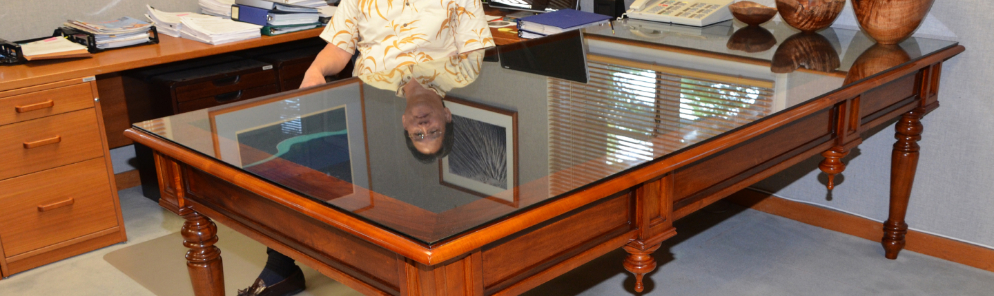 David Louie '73 behind the desk of the attorney general in Hawai'i.