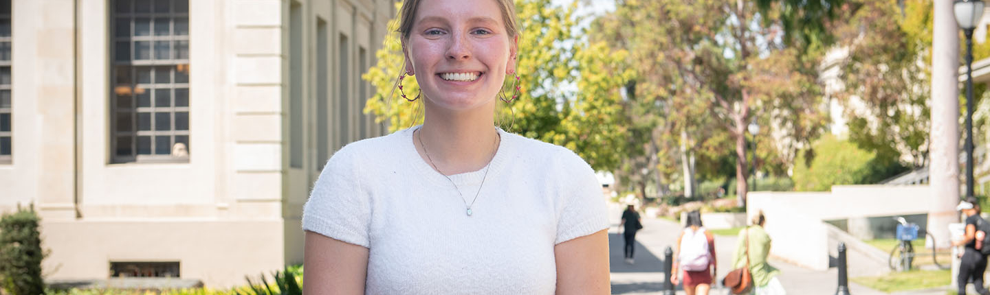 Amelia Muscott in front of the library