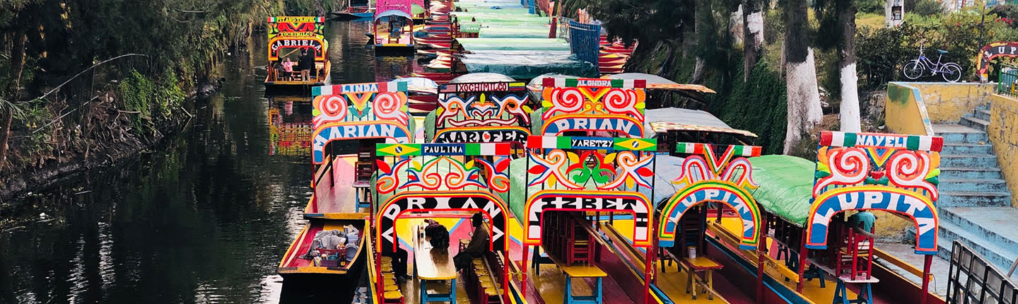 Colorful Trajinera boats at Xochimilco: showcasing a pre-hispanic canal system of Mexico City