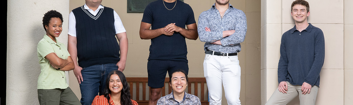 a group of 7 Obama Scholars students standing together outside