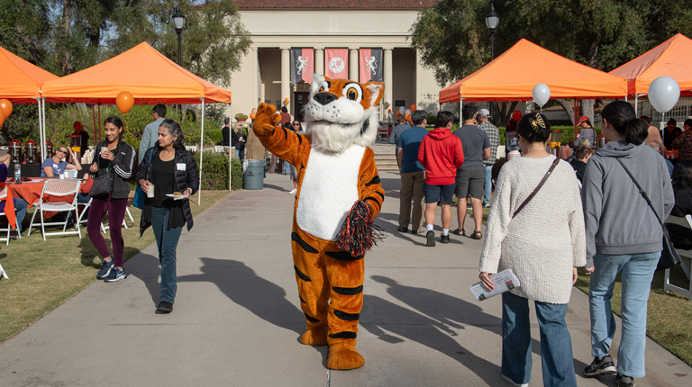 Oswald greets visitors to campus during Explore Occidental Fall Preview Day in November 2023.