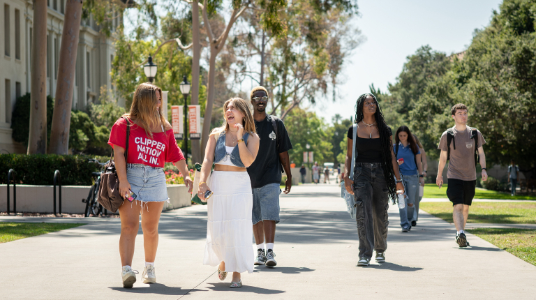 A group of Occidental (Oxy) students on the quad walking forward