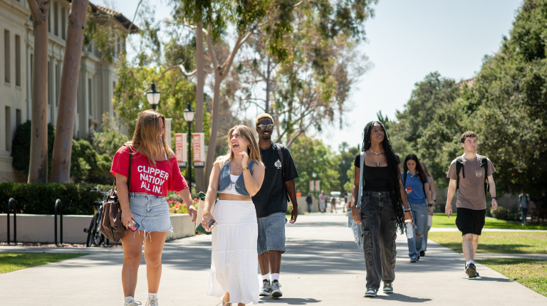 A group of Occidental (Oxy) students on the quad walking forward