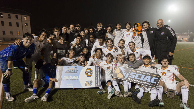 Oxy men's soccer team celebrates a SCIAC championship victory on the field
