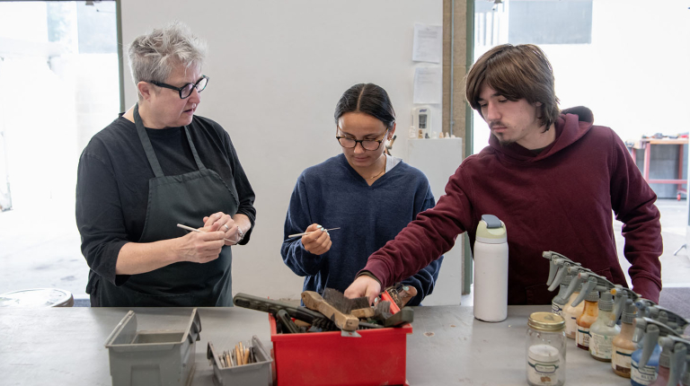 Professor Heffernan works with two Oxy students in the art studio
