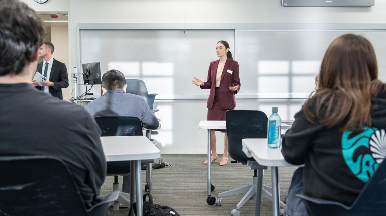 Occidental College professor Marisol Leon standing in front of a classroom of students, talking