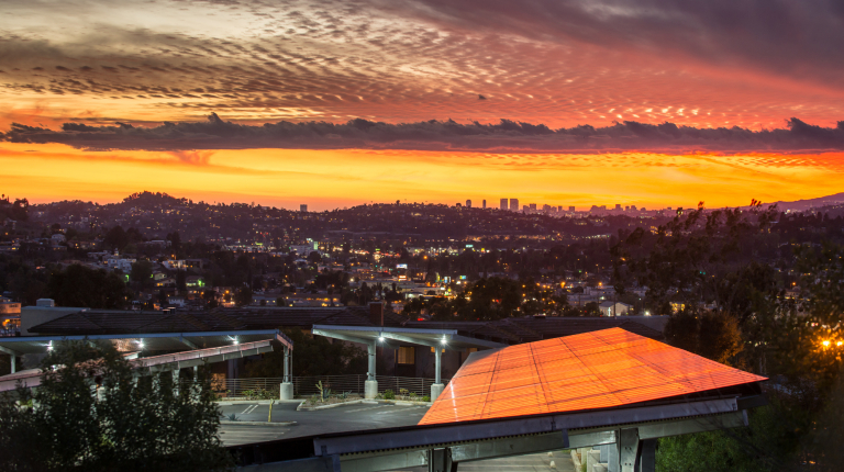 Occidental's solar array reflects a colorful sunset in 2014. 