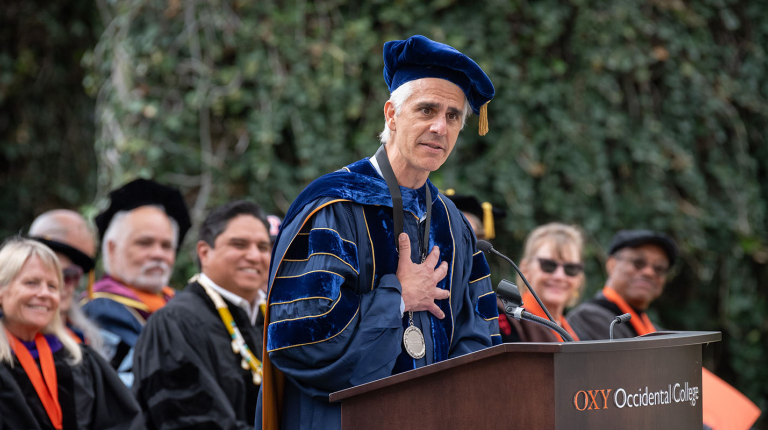 Occidental College President Tom Stritikus addresses the audience from the podium on his Inauguration Day