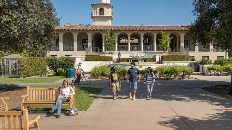 Occidental College students walk outside of the Johnson Student Center