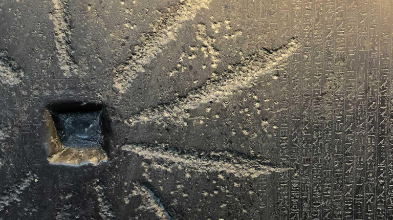 A close-up of an ancient slab of stone with carvings and heiroglyphics, representing the Comparative Studies in Literature and Culture department at Occidental College (Oxy).