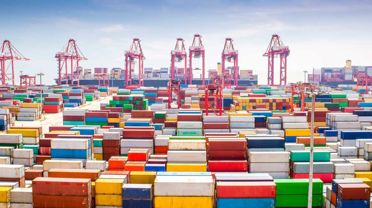  A busy maritime container port with multicolored cargo containers