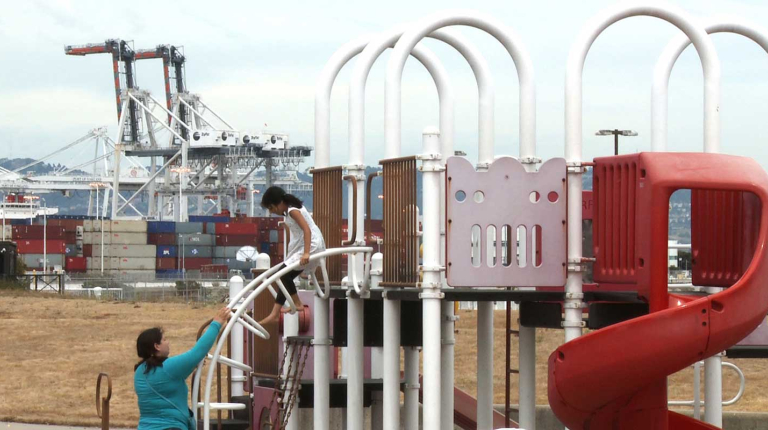 A child and adult at a playground
