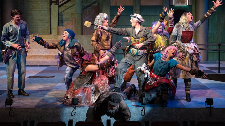 actors on a stage, all in dramatic poses