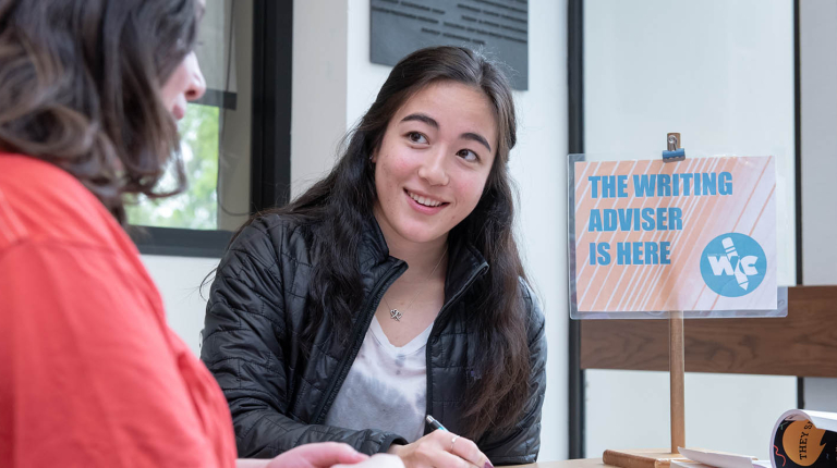 A student writing advisor at the writing center