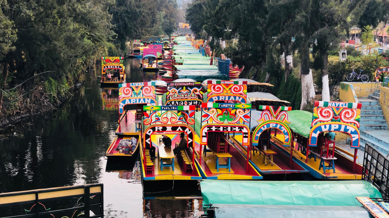 Colorful Trajinera boats at Xochimilco: showcasing a pre-hispanic canal system of Mexico City