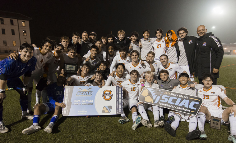 Oxy men's soccer team celebrates a SCIAC championship victory on the field
