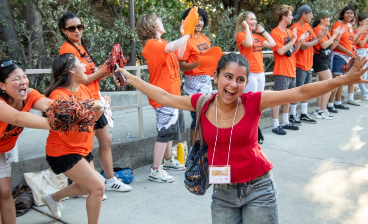 O-Team member cheer on new students as they walk into Remsen Bird Hillside Theater