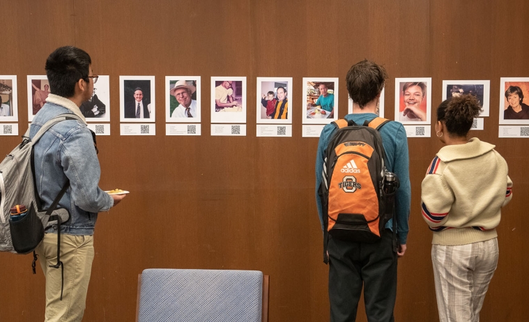 Students looking at an interactive exhibit in the Oxy library