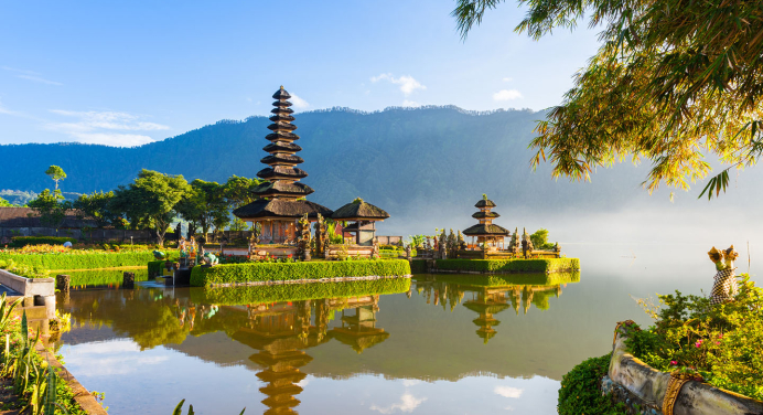 A historical building next to a river in Indonesia