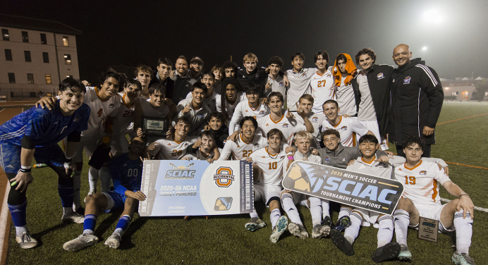 Oxy men's soccer team celebrates a SCIAC championship victory on the field