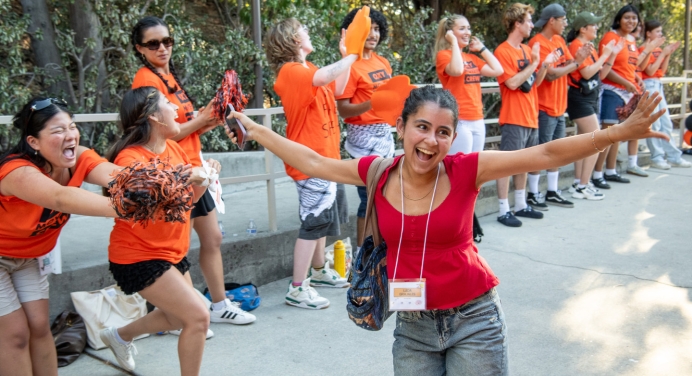 O-Team member cheer on new students as they walk into Remsen Bird Hillside Theater