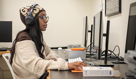 An Occidental student works on the computer in a lab.