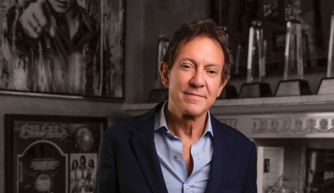 John Branca in a collared shirt and blazer in his office