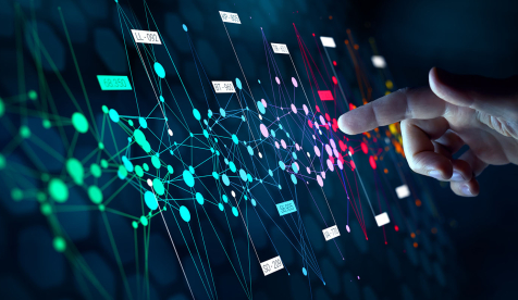 A colorful computerized schema of data and a hand pointing to a data point