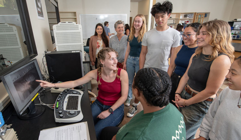 Occidental College (Oxy) students discussing data at the Lumen Lab on campus