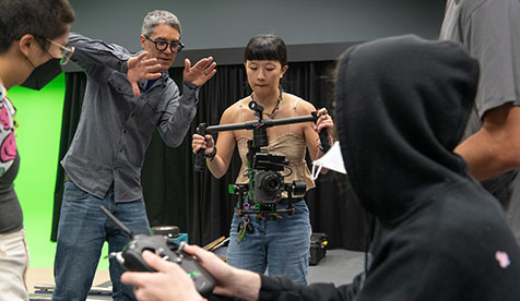 Media Arts and Culture (MAC) students at Occidental College working with a camera 