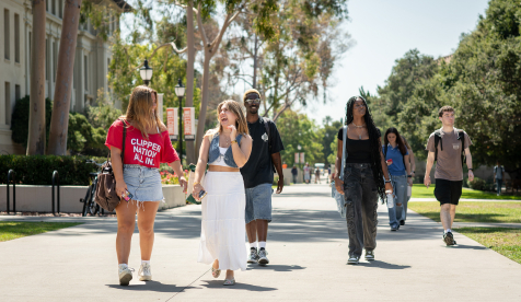 A group of Occidental (Oxy) students on the quad walking forward