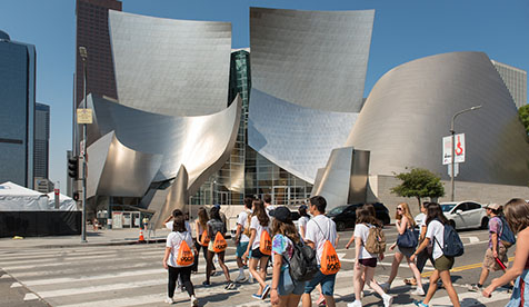 Group of Oxy students walking in front of the Walt Disney Concert Hall in downtown Los Angeles