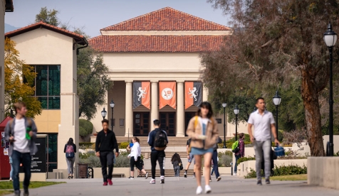 Occidental College students walking in front of Thorne Hall on campus