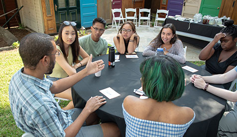 Occidental (Oxy) students sitting at rouund table in discussion