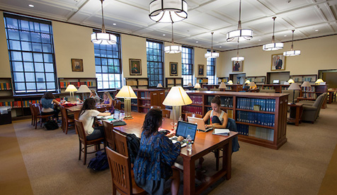 The Occidental College library reading room full of students studying