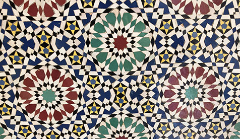 Traditional Moroccan Zellij tiles featuring complex geometric mosaic patterns.
