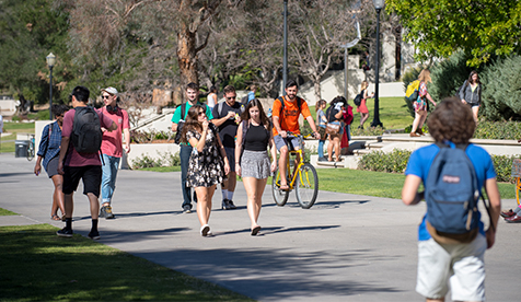 Students walking through the middle of the Occidental campus. 