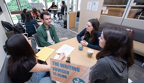 Students in the Oxy writing center having a lively discussion 