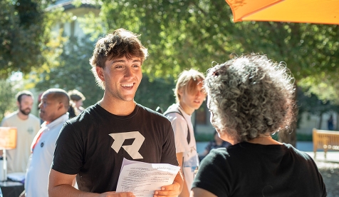 An Occidental student asks questions at orientation