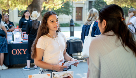 An Occidental student receives information at a resource fair on the college campus in Los Angeles