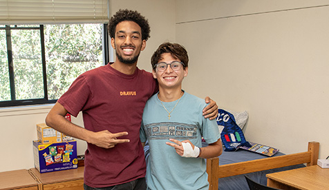 Two roommates meet in the residence hall at Occidental College