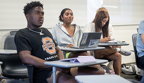 Occidental (Oxy) students sitting at desks in a classroom
