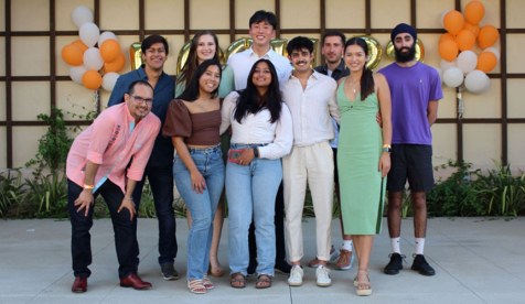 Occidental College economics students standing together in a group smiling